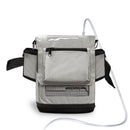 Gray Inogen One G3 portable oxygen concentrator carry bag with front pocket and tubing