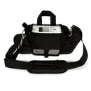 Black portable oxygen concentrator bag with shoulder strap and visible control panel