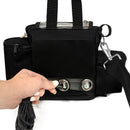 Hand connecting cable to black portable oxygen concentrator carry bag with mesh panel
