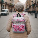 Woman wearing pink floral Inogen oxygen concentrator backpack outdoors