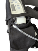 Closeup of Inogen One G3 oxygen concentrator in black carry bag with nasal cannula tubing