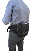 Man wearing black portable oxygen concentrator waist bag with mesh pocket on hip