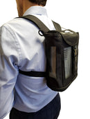 Man wearing black oxygen concentrator backpack with mesh panels on back
