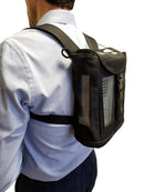 Man wearing a black Inogen One G3 portable oxygen backpack carrier