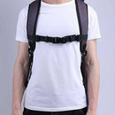 Adjustable black backpack chest strap on person wearing white shirt, respiratory accessories
