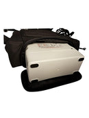 Inogen One G4 portable oxygen concentrator in a black zippered carry bag, partial close-up view